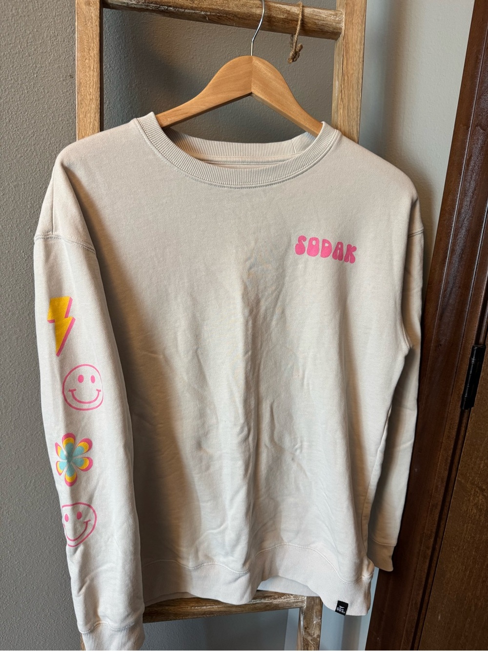 Sodak Cream Crewneck Sweatshirt with Pink Logo and Multicolor Sleeve Prints